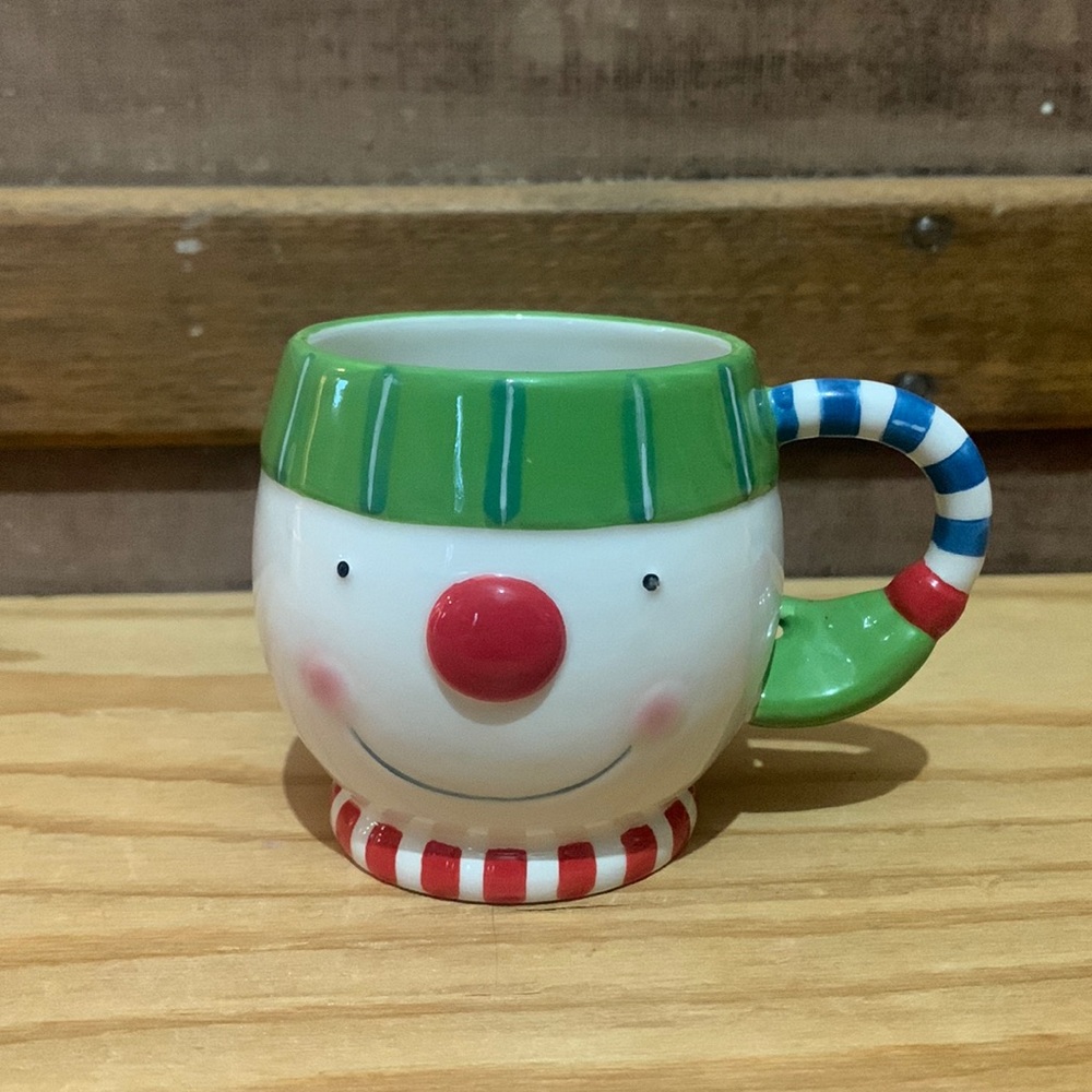 Little ceramic snowman mug. Department 56. Round shape  snowman head with scarf